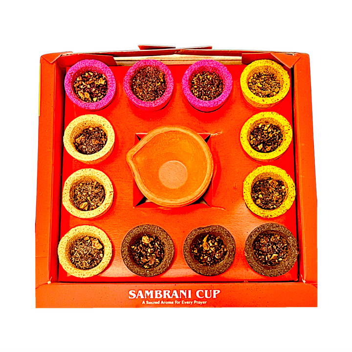 Open box showing 12 sambrani cups in four colors around the clay holder