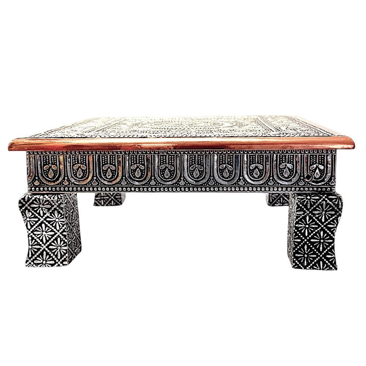Quality Indian Goods Bajat Oxidised 10 inch square puja table with short legs, featuring intricate silver-tone metalwork and a copper-toned wooden border.