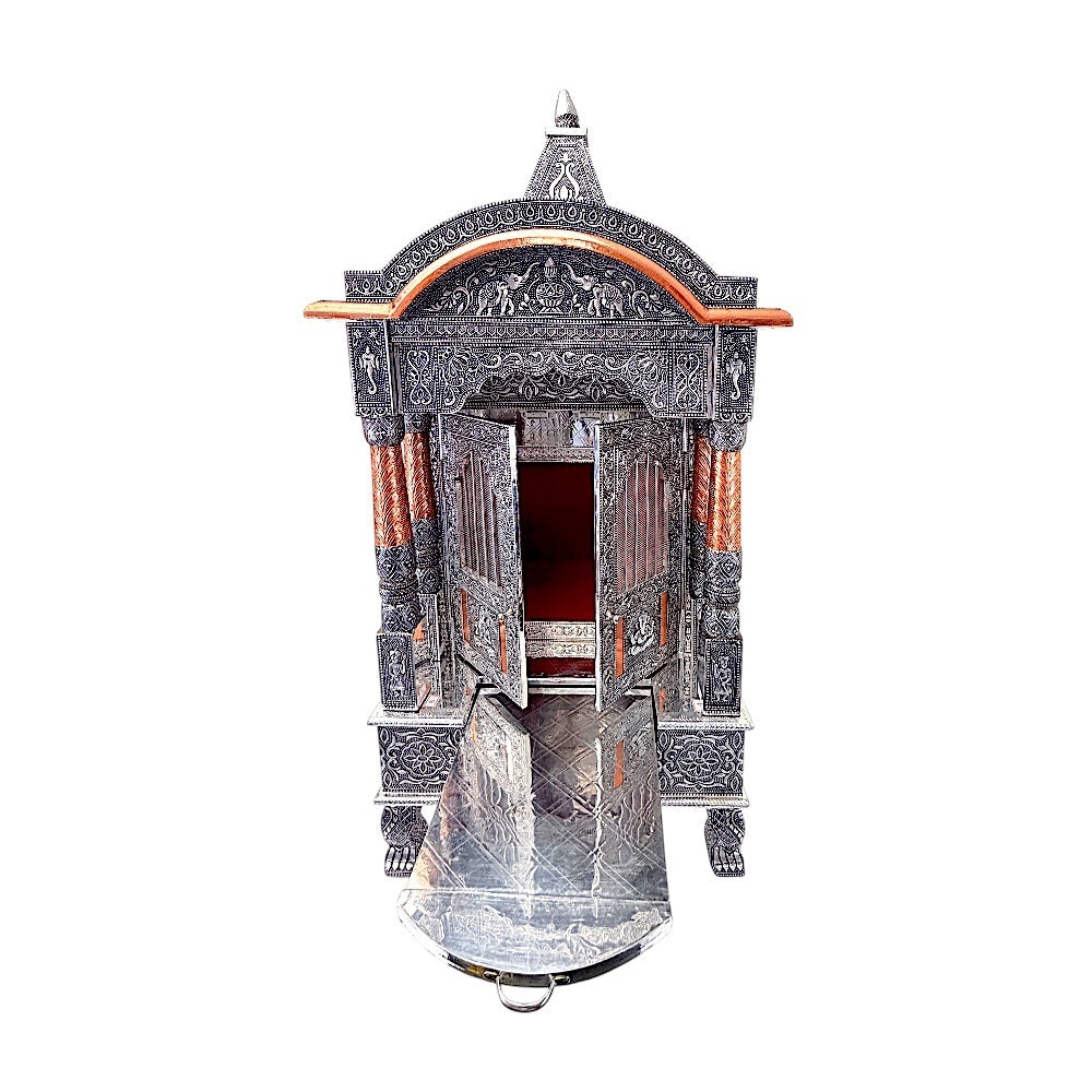 Quality Indian Goods 18-inch wide oxidized silver mandir with intricate carvings and copper accents. Features double doors and a pull-out tray.